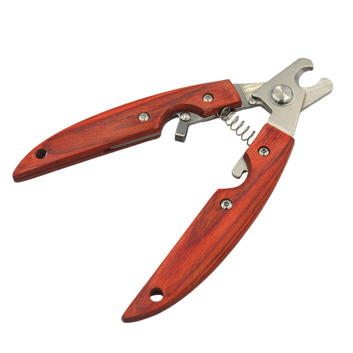 Dog nail clippers with red-brown wooden handles held open, showing the stainless steel cutting head