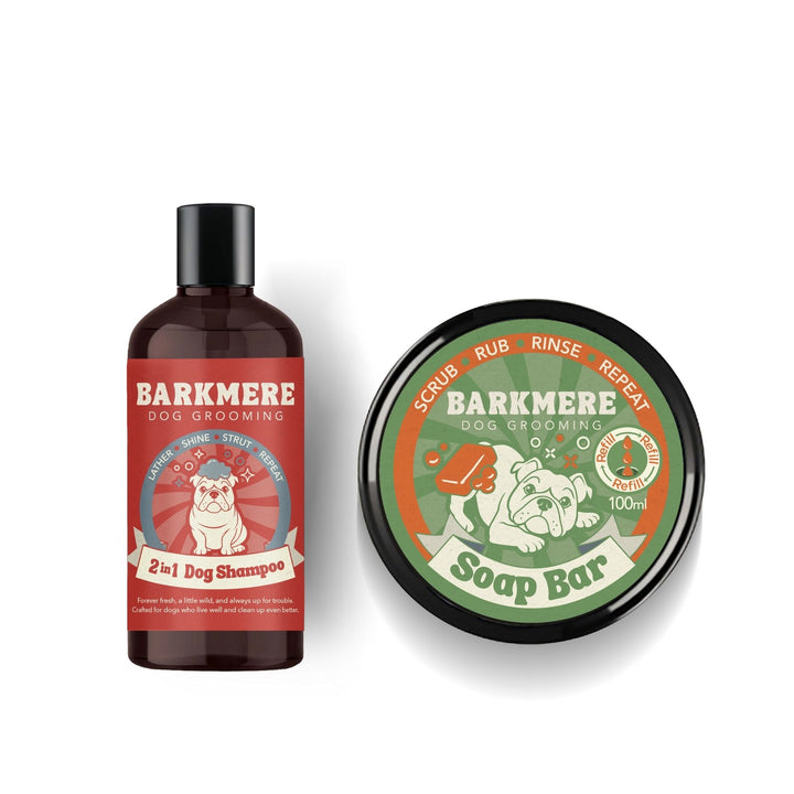 The red-labelled 2 in 1 Dog Shampoo bottle standing beside the green 100ml Soap Bar tin on white