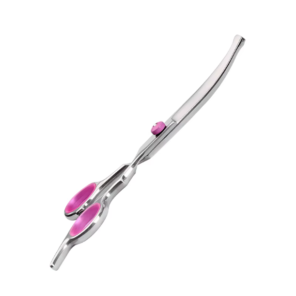 Curved-blade grooming scissors seen edge-on, showing the curve of the blade and pink finger rings