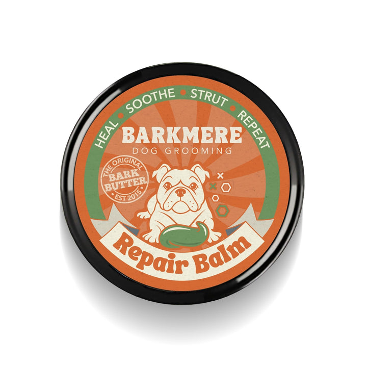 Bark Butter Balm in a black tin, viewed from above, with the orange Barkmere Repair Balm lid design