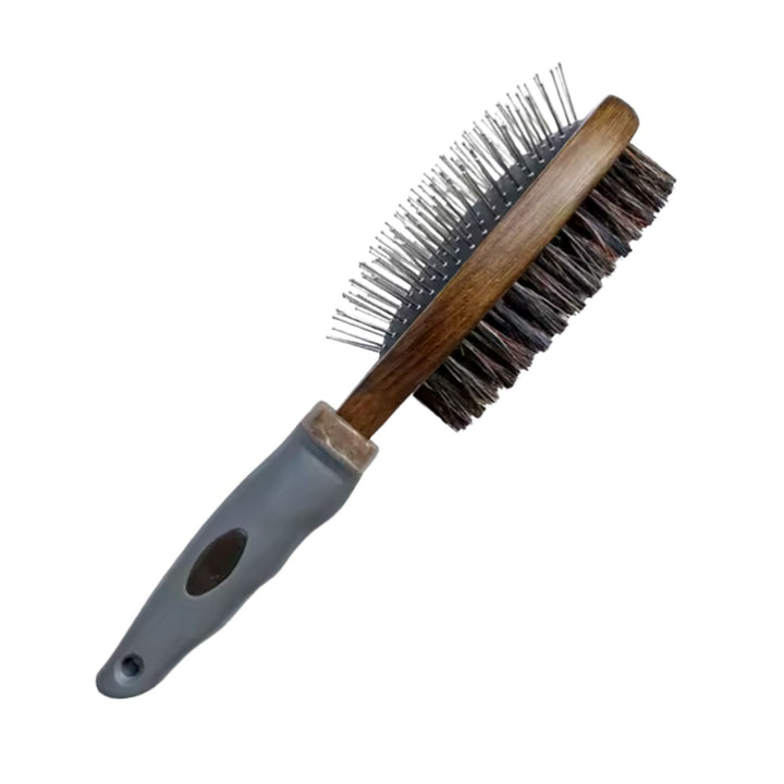 Double-sided coat brush with a timber head, grey grip handle, metal pins on one side and dark bristles
